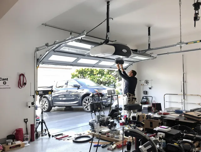 Berea Garage Door Repair specialist installing smart garage door opener system in Berea home