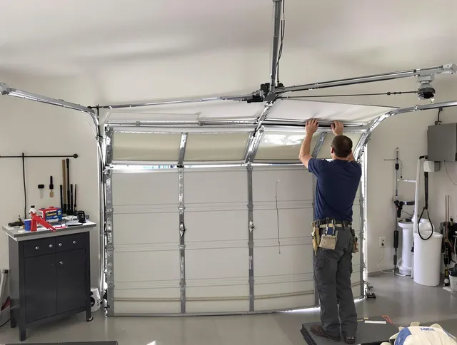 Berea Garage Door Repair specialist performing precise section replacement on Berea garage door